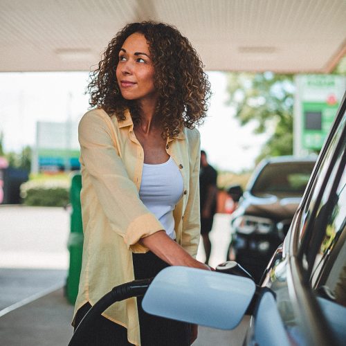 woman filling up at the petrol pump