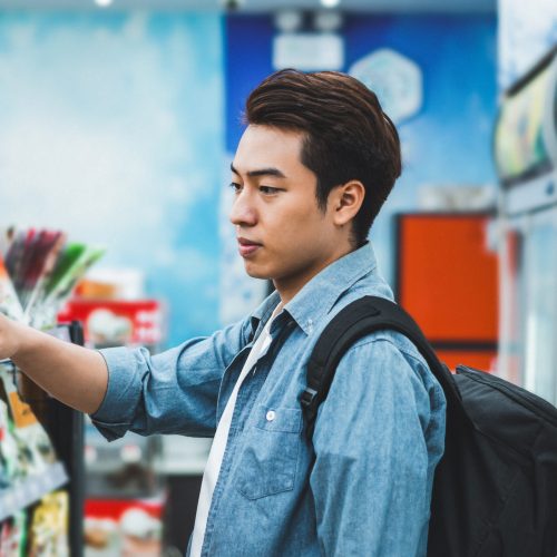 image of Asian man shopping at a convenience store